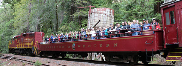 photo of the skunk train on a tour with people and pets.
