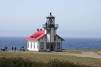 photo of the point cabrillo lighthouse next to the ocean.