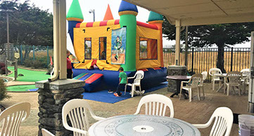 photo of children in the bounce house at Emerald Dolphin.