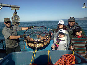 Photo of family fishing off a charter boat.