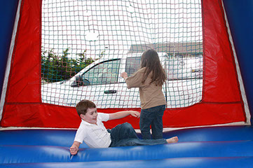 photo of children in the bounce house at Emerald Dolphin.