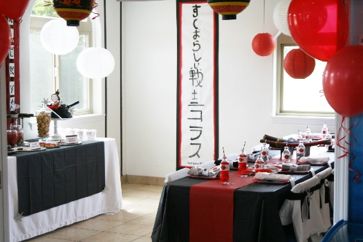 Photo showing a themed party with black, pink and white colors.