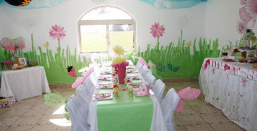 Photo shows one of the themes used for a party. colorful lime green with pink flowers and decorations.