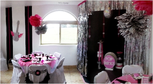 Photo showing a themed party with black, pink and white colors.
